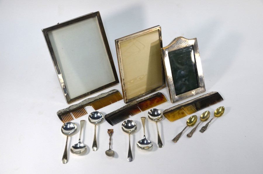 Three silver-faced photograph frames etc