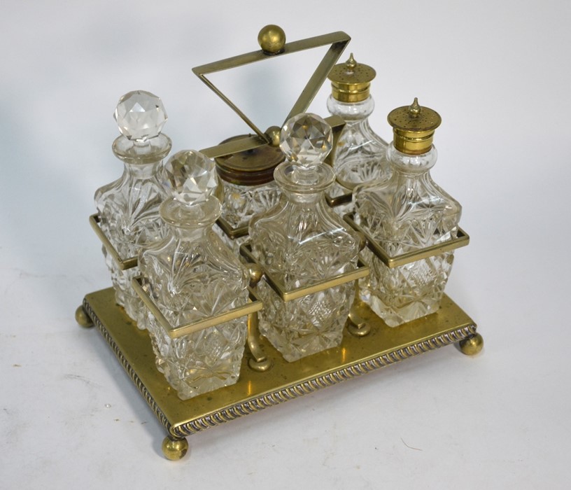 A conical cut glass decanter with silver collar and other items