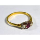 An 18ct yellow gold ring set with ruby and two diamonds