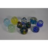 Twenty-four various glass paperweights