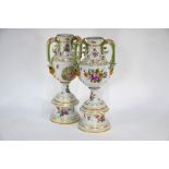 A good pair of late 19th century Dresden china baluster vases