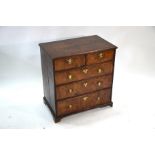 An 18th century and later altered cross-banded walnut and oak chest of drawers