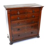 A figured mahogany chest of two short over four long graduated drawers