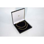 An 18ct yellow gold and diamond necklace and bracelet set