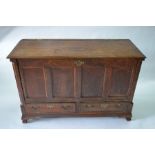 An 18th century oak mule chest, 134 cm w x 52 cm x 87 cm h