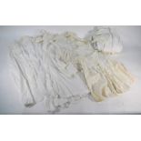 A collection of Edwardian and later white cotton Christening robes