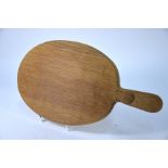 A Thompson of Kilburn 'Mouseman' oval oak cheeseboard