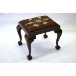 A 19th century mahogany dressing stool in the Chippendale manner
