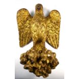 An antique giltwood spread eagle mount / bracket, 36 cm h