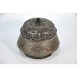 A 19th century Middle Eastern copper pot and cover with white metal overlay