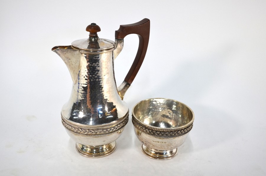 A heavy quality planished silver coffee pot and sugar basin