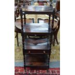 A Victorian mahogany four tier what-not with mid-height drawer