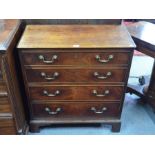 A George III mahogany chest of four long graduated drawers