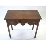 A 17th century style oak side table