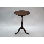 A George III mahogany tilt top wine table