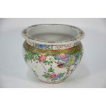 An early 20th century Chinese famille rose jardiniere, 20 cm high
