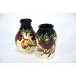 Two modern Moorcroft 'Anna Lily' pattern small vases,