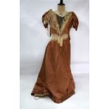 A Victorian lady's two piece dress in pale brown satin