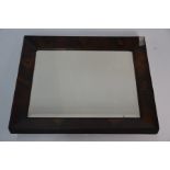 An antique oyster veneered mirror