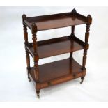 A Victorian mahogany three tier buffet with drawer to base
