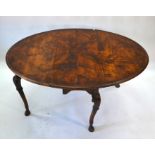 An antique fruitwood/walnut gateleg drop leaf dining table
