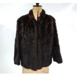 A dark brown mink fur jacket