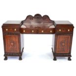 A Regency flame mahogany pedestal sideboard