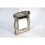 An Edwardian Art Nouveau silver-faced easel mirror