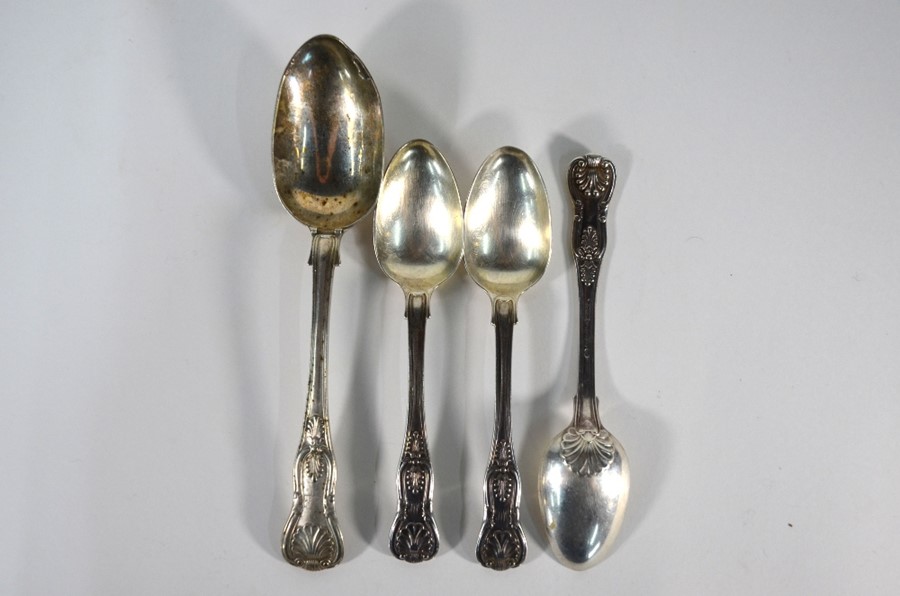 A Victorian King's pattern table spoon and three earlier dessert spoons