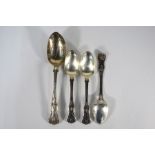 A Victorian King's pattern table spoon and three earlier dessert spoons