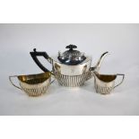 A late Victorian oval half-reeded three piece bachelor tea service