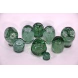 Two pairs of Stourbridge green glass 'dump' paperweights