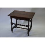 An antique provincial oak side table