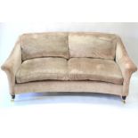 A contemporary plush upholstered two/three seat sofa of concave form