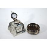 A heavy cut glass inkwell/paperweight of square tapering form