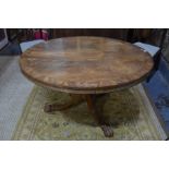 A Regency wide cross-banded flame mahogany breakfast table