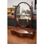 A 19th century mahogany oval toilet mirror