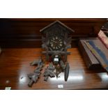 An antique stained pine Swiss cuckoo clock