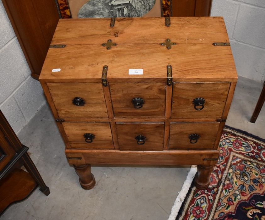 A small Indonesian hardwood brass bound chest on stand