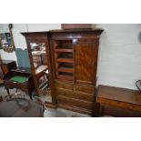 James Shoolbred & Co, London - A 19th century mahogany step-front compactum wardrobe