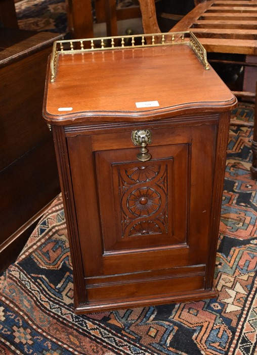 An Edwardian carved and panelled mahogany purdonium