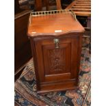 An Edwardian carved and panelled mahogany purdonium