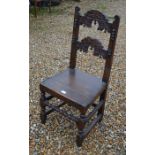 An antique caned oak side chair