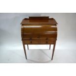 A 19th century mahogany inlaid cylinder top desk
