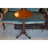 A mahogany occasional table