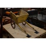 A vintage painted wood model farm cart