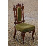 A carved mahogany side chair
