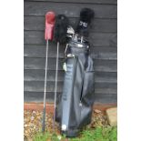 A mixed set of golf clubs