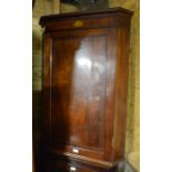 A 19th century mahogany and shell inlaid hanging corner cupboard