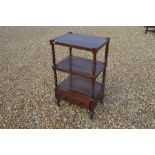 A Victorian rosewood three-tier dumbwaiter